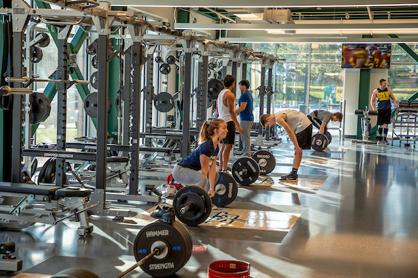 a student lifting weights